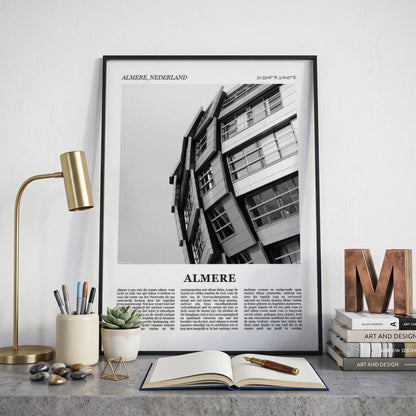 Ingelijste Almere Fotoposter – Zwart-Wit op een bureau in zwarte fotolijst