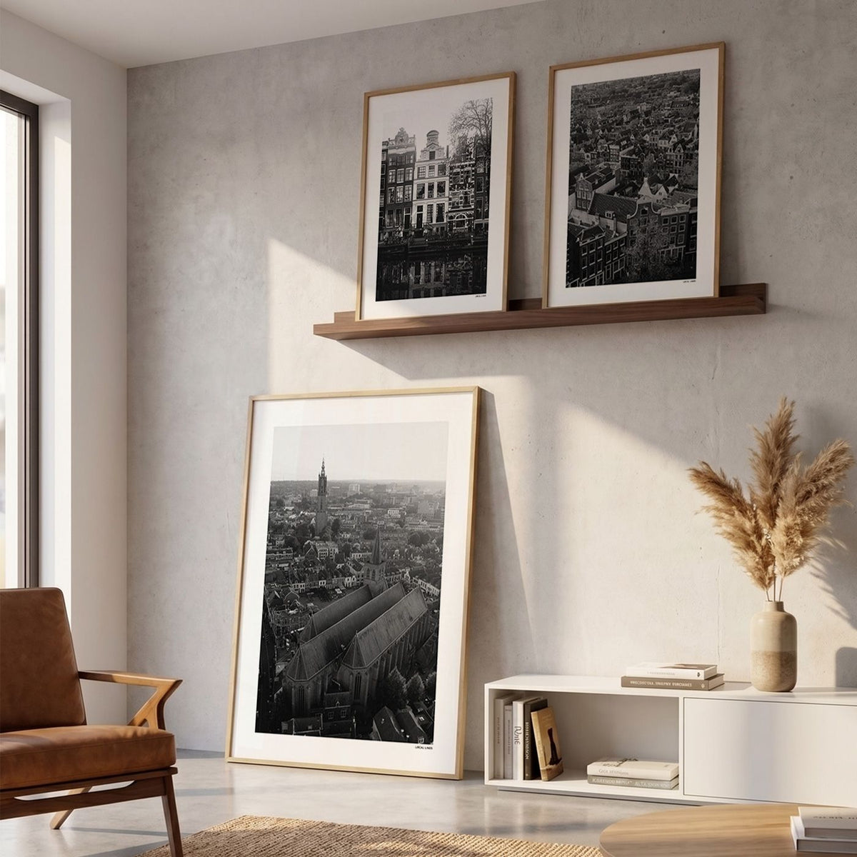 Drie fotoposters in woonkamer interieur - Zwart-Wit