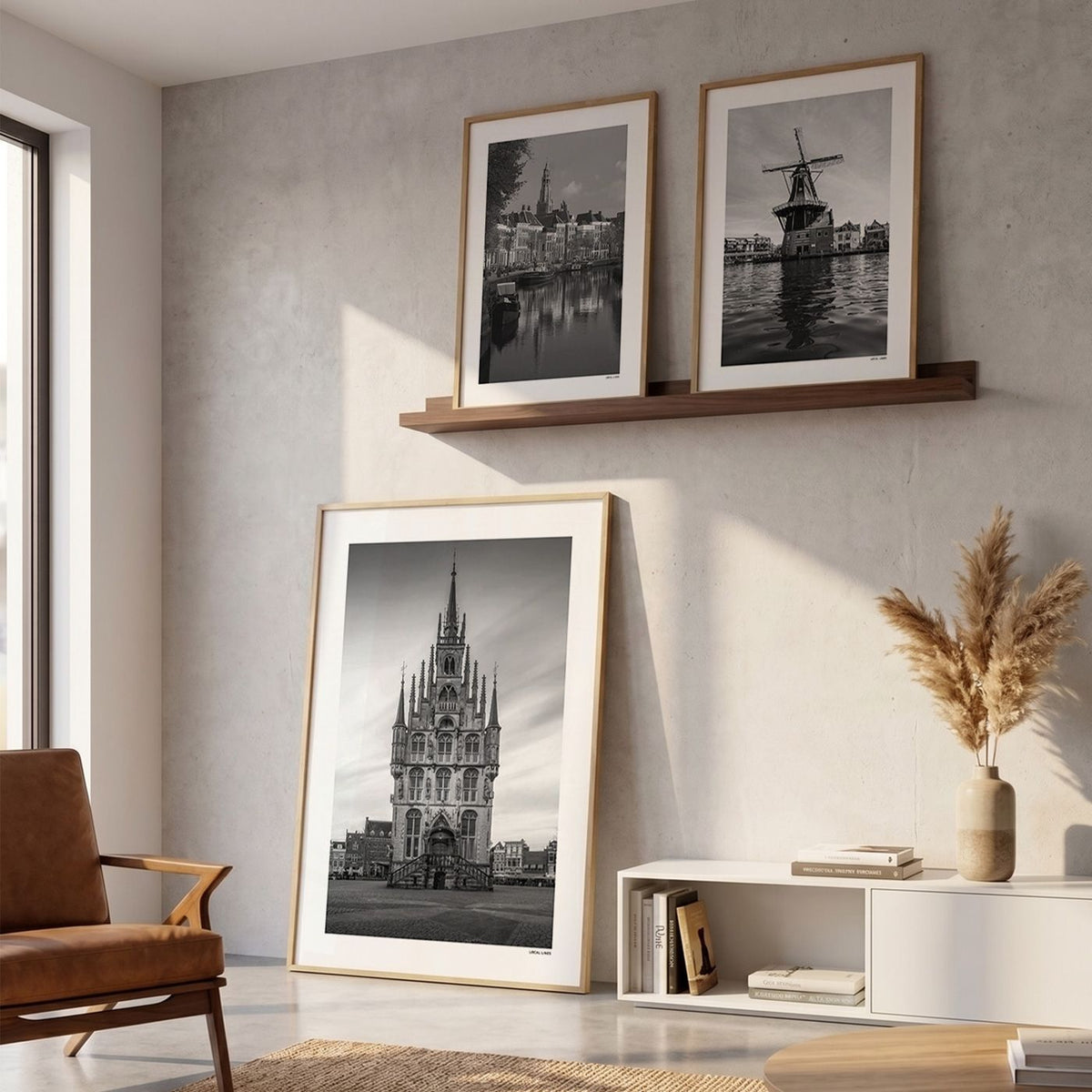 Drie fotoposters in woonkamer interieur - Zwart-Wit